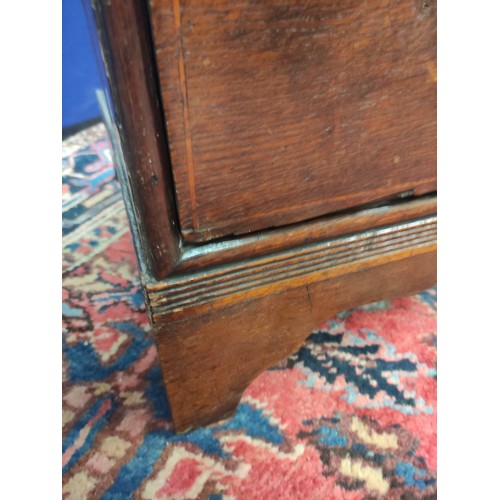 618 - 18th century oak chest of four graduated drawers, moulded edge top and drop handles on bracket feet,... 