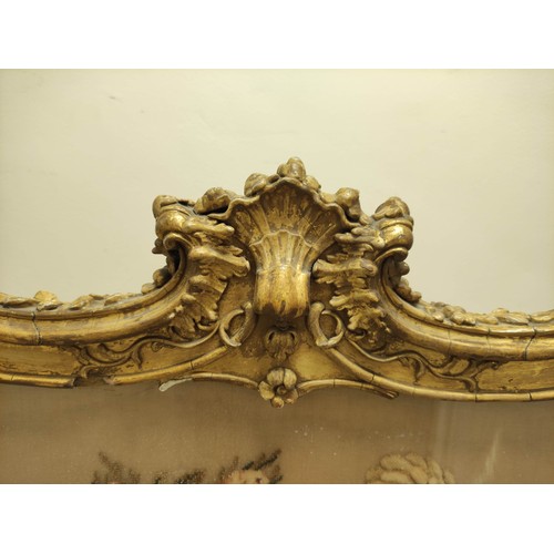 621 - Ornate 19th century firescreen, the foliate scroll gilt frame enclosing a cushioned tapestry depicti... 