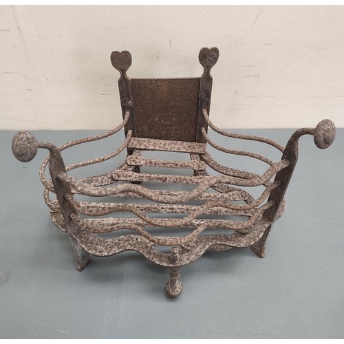 623 - Antique wrought metal fire basket with wavy rail edge, 46cm wide.