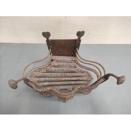 623 - Antique wrought metal fire basket with wavy rail edge, 46cm wide.