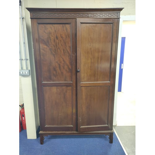 631 - 20th century mahogany wardrobe, the pair of double panel doors enclosing interior with hanging space... 