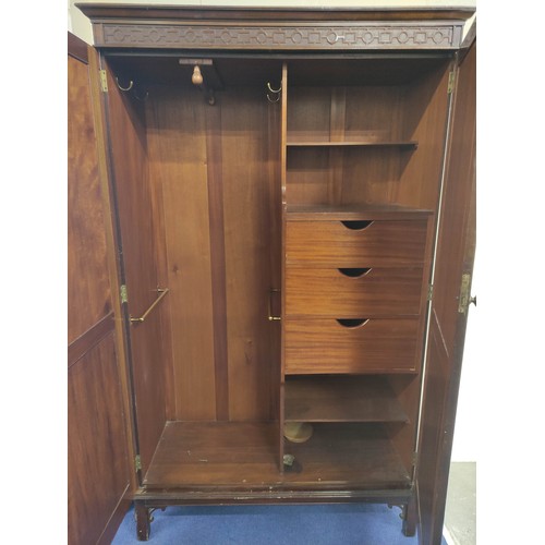 631 - 20th century mahogany wardrobe, the pair of double panel doors enclosing interior with hanging space... 