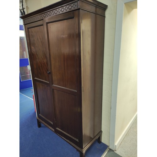 631 - 20th century mahogany wardrobe, the pair of double panel doors enclosing interior with hanging space... 