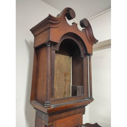 578 - Early 19th century oak case for a longcase clock, swan neck pediment and crossbanded door and base o... 