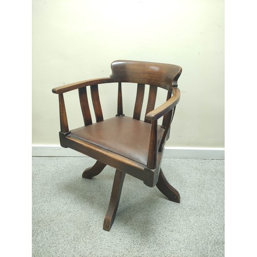 638 - Mid 20th century bow back revolving office chair with vertical splats and slip in seat on quatreform... 