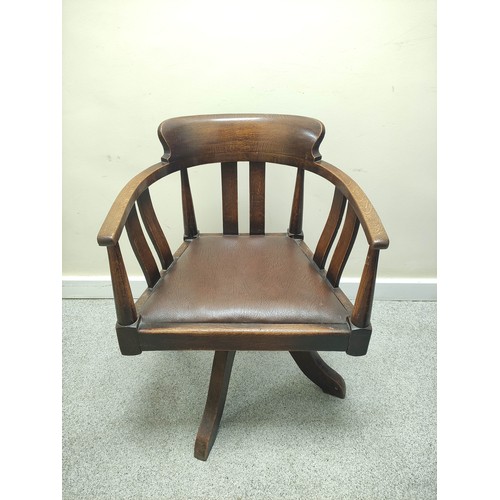 638 - Mid 20th century bow back revolving office chair with vertical splats and slip in seat on quatreform... 