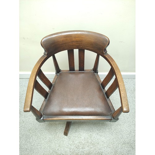 638 - Mid 20th century bow back revolving office chair with vertical splats and slip in seat on quatreform... 