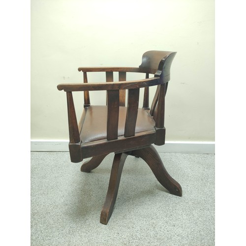 638 - Mid 20th century bow back revolving office chair with vertical splats and slip in seat on quatreform... 