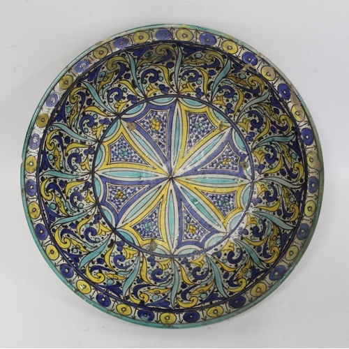 258 - 19th century Islamic tin glazed earthenware bowl, probably Moroccan, decorated in blue, turquoise an... 