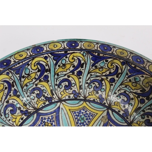 258 - 19th century Islamic tin glazed earthenware bowl, probably Moroccan, decorated in blue, turquoise an... 