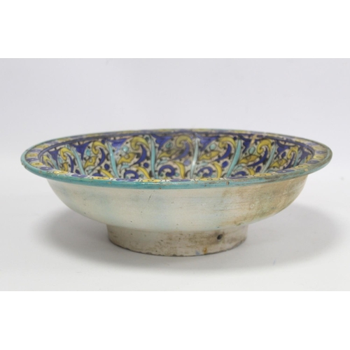 258 - 19th century Islamic tin glazed earthenware bowl, probably Moroccan, decorated in blue, turquoise an... 