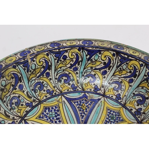 258 - 19th century Islamic tin glazed earthenware bowl, probably Moroccan, decorated in blue, turquoise an... 