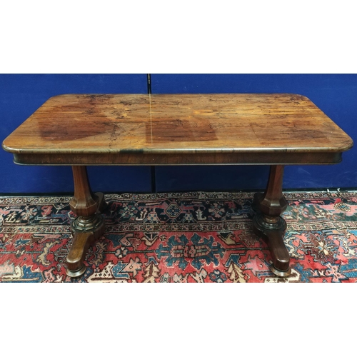 647 - Early Victorian rosewood library table, the rectangular top with curved corners on pair of octagonal... 