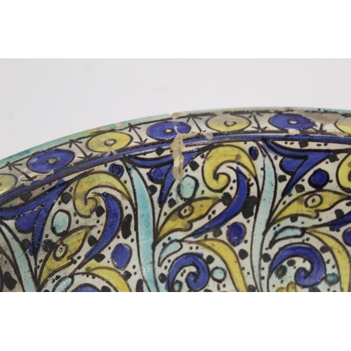 258 - 19th century Islamic tin glazed earthenware bowl, probably Moroccan, decorated in blue, turquoise an... 