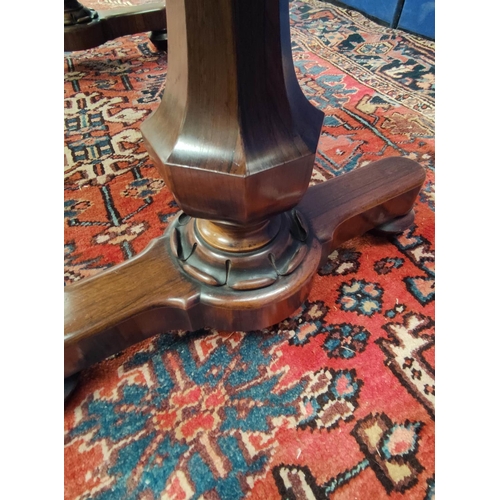 647 - Early Victorian rosewood library table, the rectangular top with curved corners on pair of octagonal... 