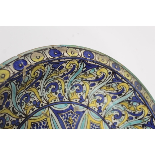 258 - 19th century Islamic tin glazed earthenware bowl, probably Moroccan, decorated in blue, turquoise an... 