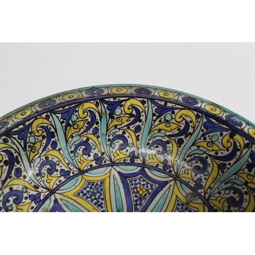 258 - 19th century Islamic tin glazed earthenware bowl, probably Moroccan, decorated in blue, turquoise an... 