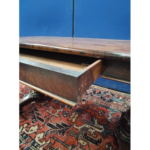 647 - Early Victorian rosewood library table, the rectangular top with curved corners on pair of octagonal... 