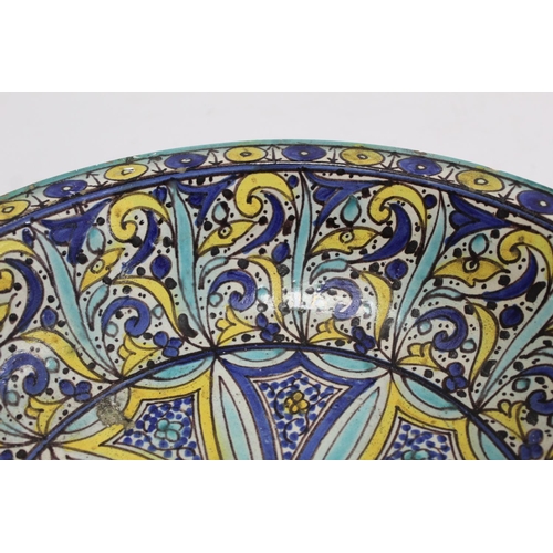 258 - 19th century Islamic tin glazed earthenware bowl, probably Moroccan, decorated in blue, turquoise an... 