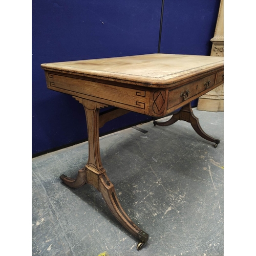 648 - Faded mahogany Regency writing table, ebonised stringing, the rectangular top with curved corners an... 