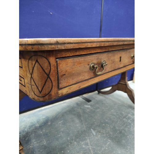 648 - Faded mahogany Regency writing table, ebonised stringing, the rectangular top with curved corners an... 