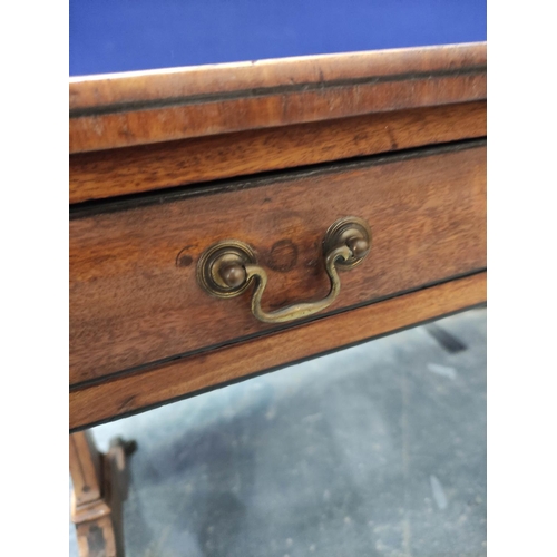 648 - Faded mahogany Regency writing table, ebonised stringing, the rectangular top with curved corners an... 