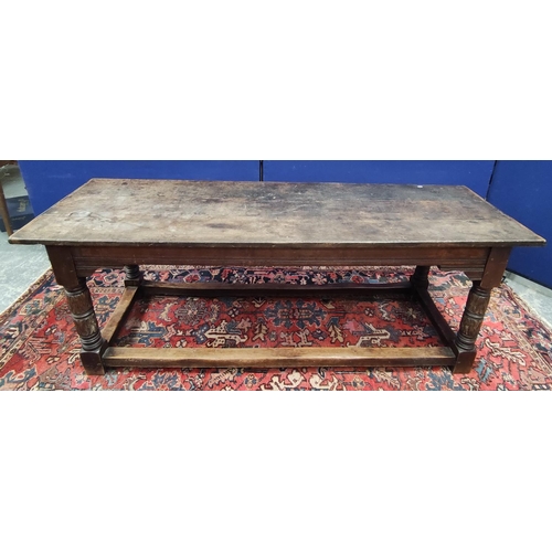 651 - Antique oak refectory table in the 17th century style with cleated triple plank top on foliate and r... 