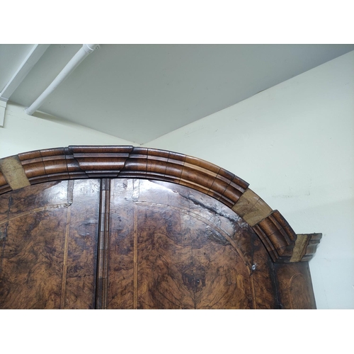 652 - 18th century North European figured walnut dome top standing corner cupboard, the moulded pediment a... 