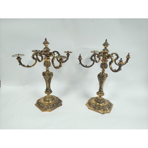 100 - Fine and impressive pair of silver gilt four-branch candelabra, of early 18th century style, with ch... 