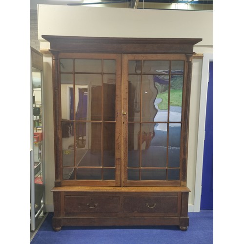 583 - Oak cabinet bookcase, c.1890's, the upper section with moulded pediment above glazed astragal doors ... 