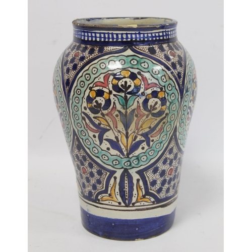 192 - Islamic Iznik style tin glazed earthenware vase of baluster form, probably Moroccan, with four circu... 