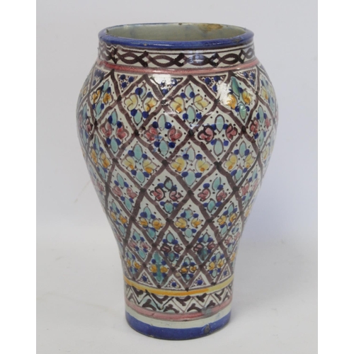 193 - Islamic Iznik style tin glazed earthenware vase of baluster form, probably Moroccan, with polychrome... 