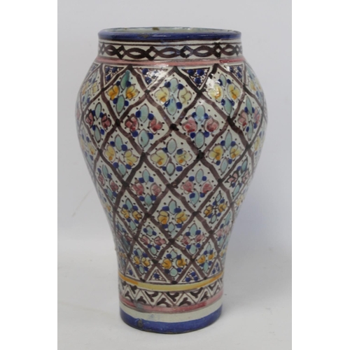 193 - Islamic Iznik style tin glazed earthenware vase of baluster form, probably Moroccan, with polychrome... 