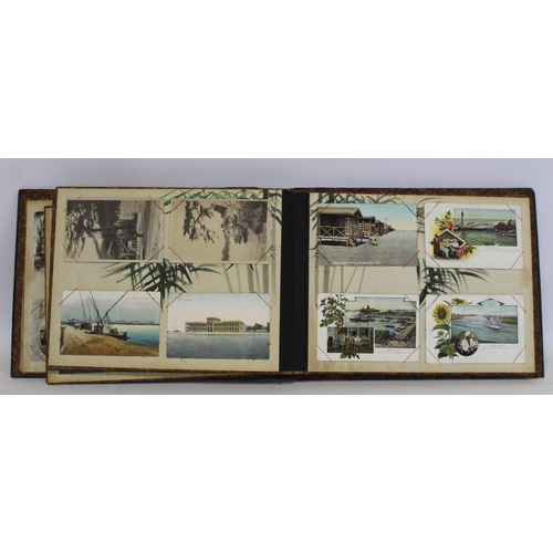 194 - Near pair of early 20th century Japanese lacquer photograph albums, one containing photographs inclu... 