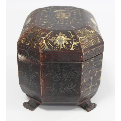 287 - 19th century Chinese black lacquer tea caddy of octagonal form with four paw feet and gilt painted p... 