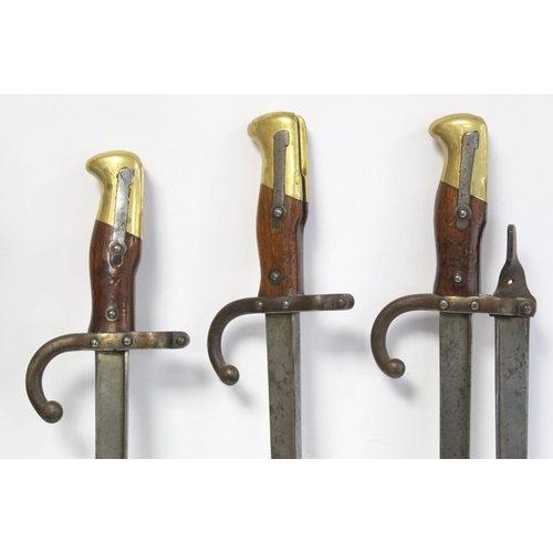 294 - Late 19th/early 20th century novelty fireside companion set made from French bayonets, each signed a... 