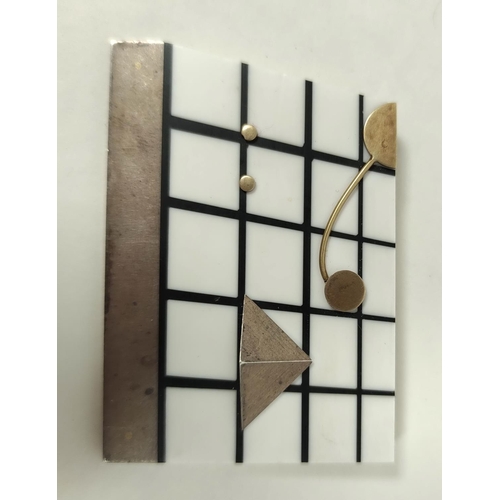 124 - Acrylic brooch of abstract form, with gold and silver upon a lattice, monogrammed, by Roger Morris. ... 