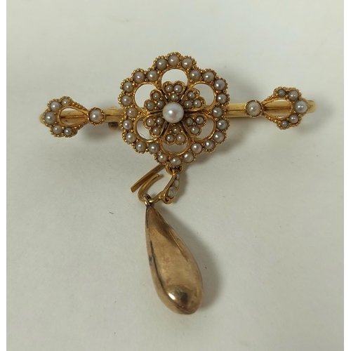 131 - Victorian pearl bar brooch with drop, in gold ' 15ct'.