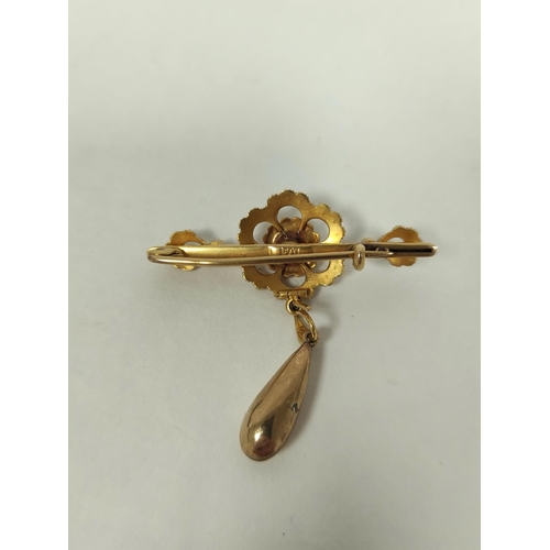 131 - Victorian pearl bar brooch with drop, in gold ' 15ct'.