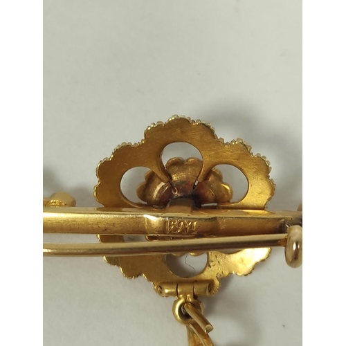 131 - Victorian pearl bar brooch with drop, in gold ' 15ct'.