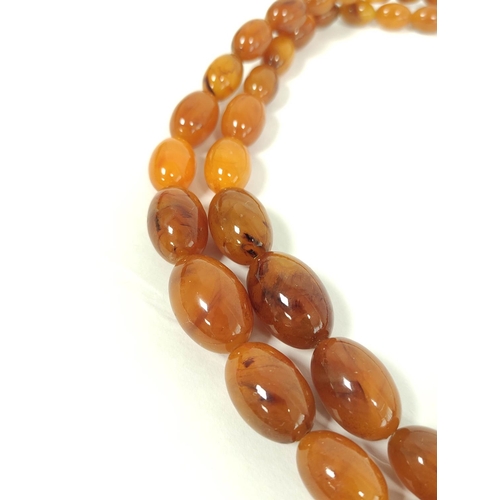 85 - Amber graduated two row necklace, uncertified, 92g.