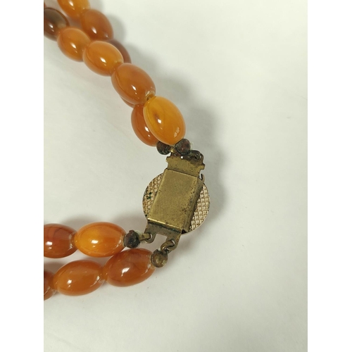 85 - Amber graduated two row necklace, uncertified, 92g.