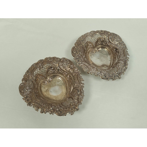 91 - Pair of pierced and embossed bon bon dishes of heart shape, 133g.