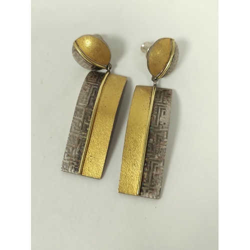 96 - Silver and gold square brooch, a pair of rectangular drop earrings, silver fronted with gold and ano... 