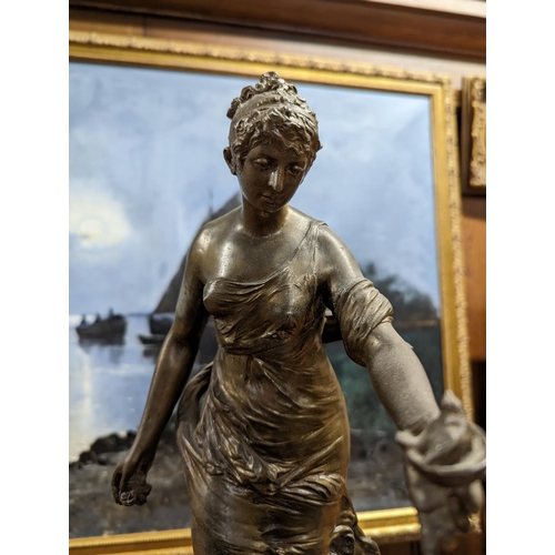 397 - French gilt spelter and onyx figural mantle clock, the top with a standing female allegorical figure... 