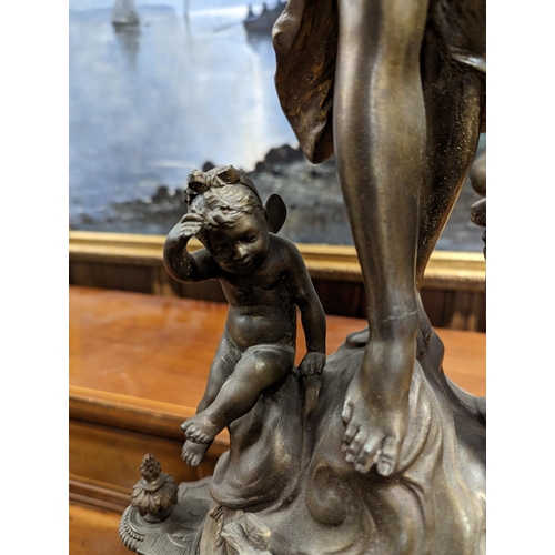 397 - French gilt spelter and onyx figural mantle clock, the top with a standing female allegorical figure... 