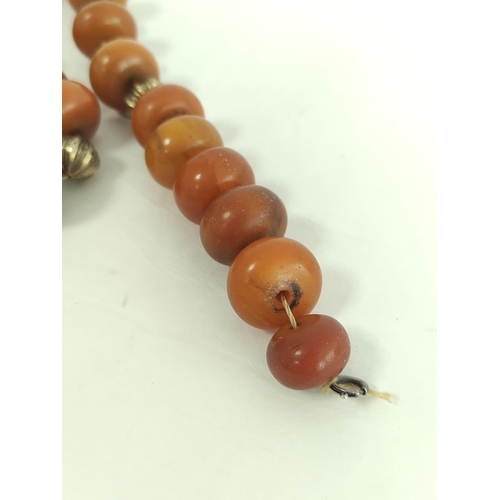 108 - Amber necklace of tablet links with drops, 85g and another. (2).