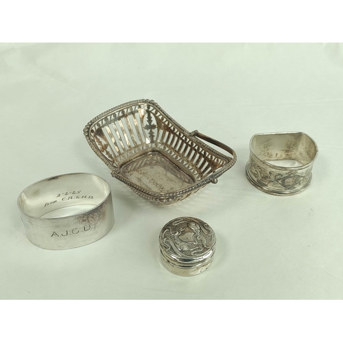 121 - Silver pierced trug bon bon dish, two napkin rings and a small box, 103g.