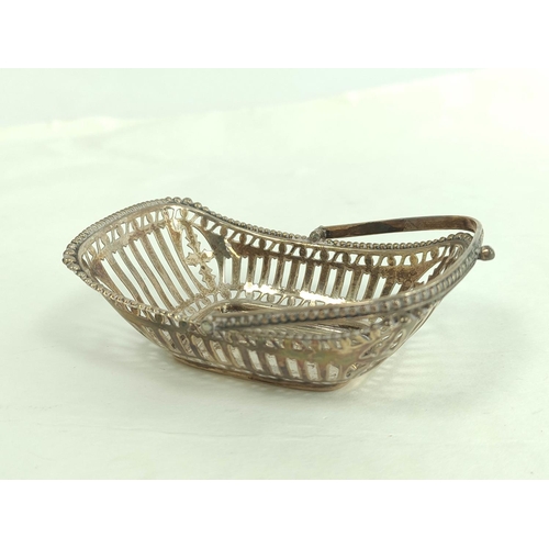 121 - Silver pierced trug bon bon dish, two napkin rings and a small box, 103g.