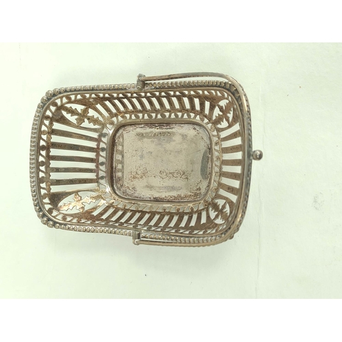 121 - Silver pierced trug bon bon dish, two napkin rings and a small box, 103g.